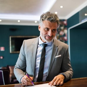 mature businessman at hotel reception